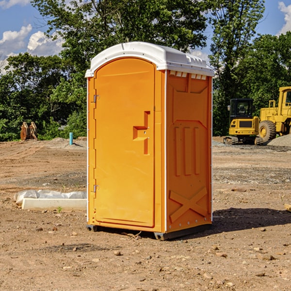 what is the cost difference between standard and deluxe portable restroom rentals in Dell